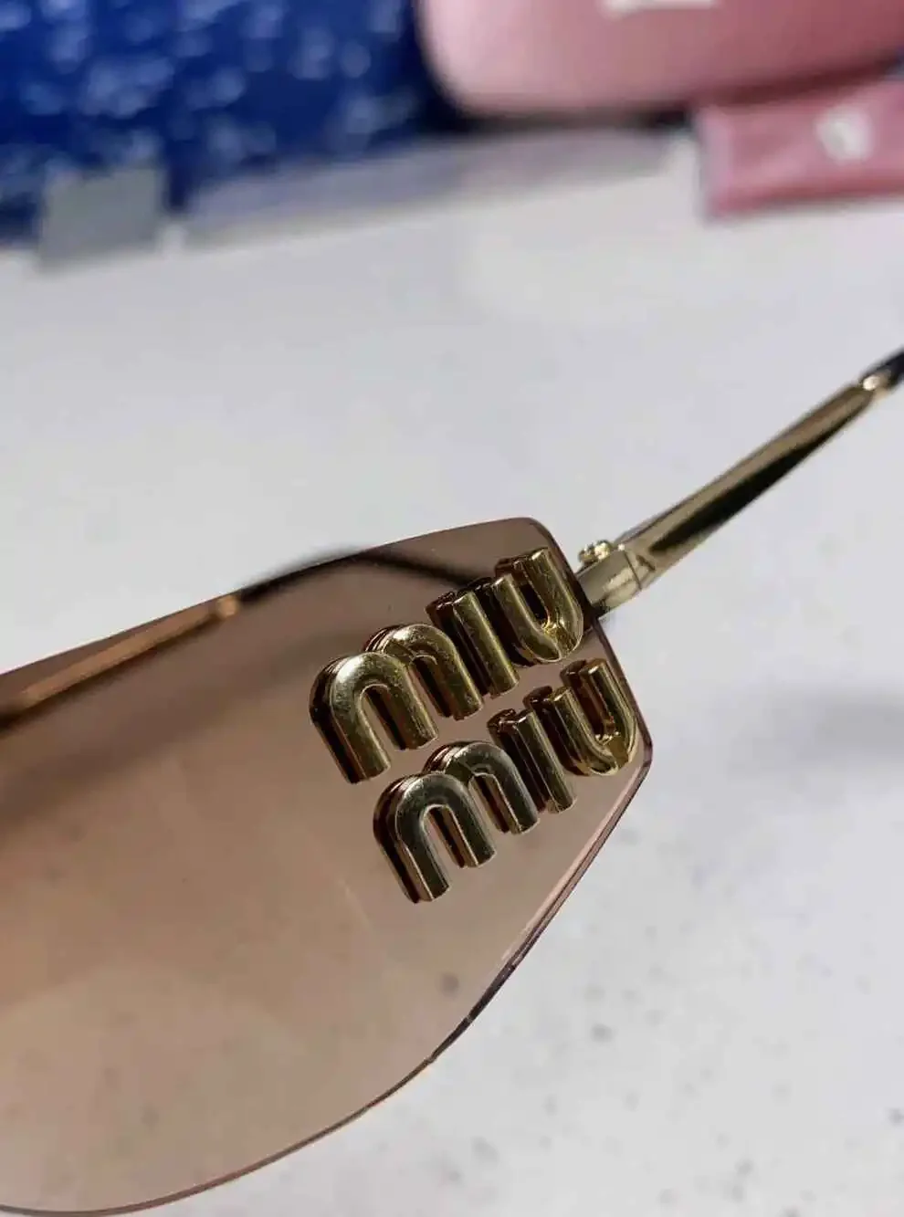 Miu Miu Rimless Gradient Brown Lens Gold Logo Sunglasses